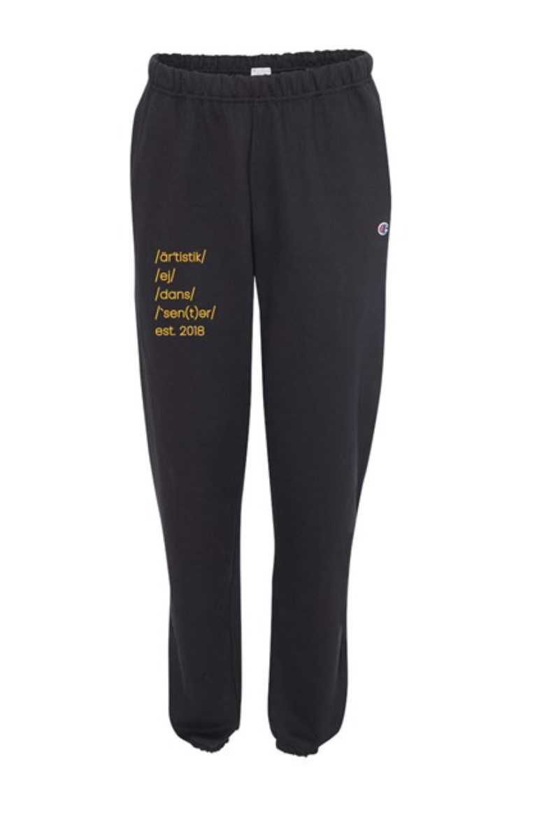 black sweatpants that have a graphic on the right pant leg that reads the pronunciation of 'Artistic Edge Dance Centre'