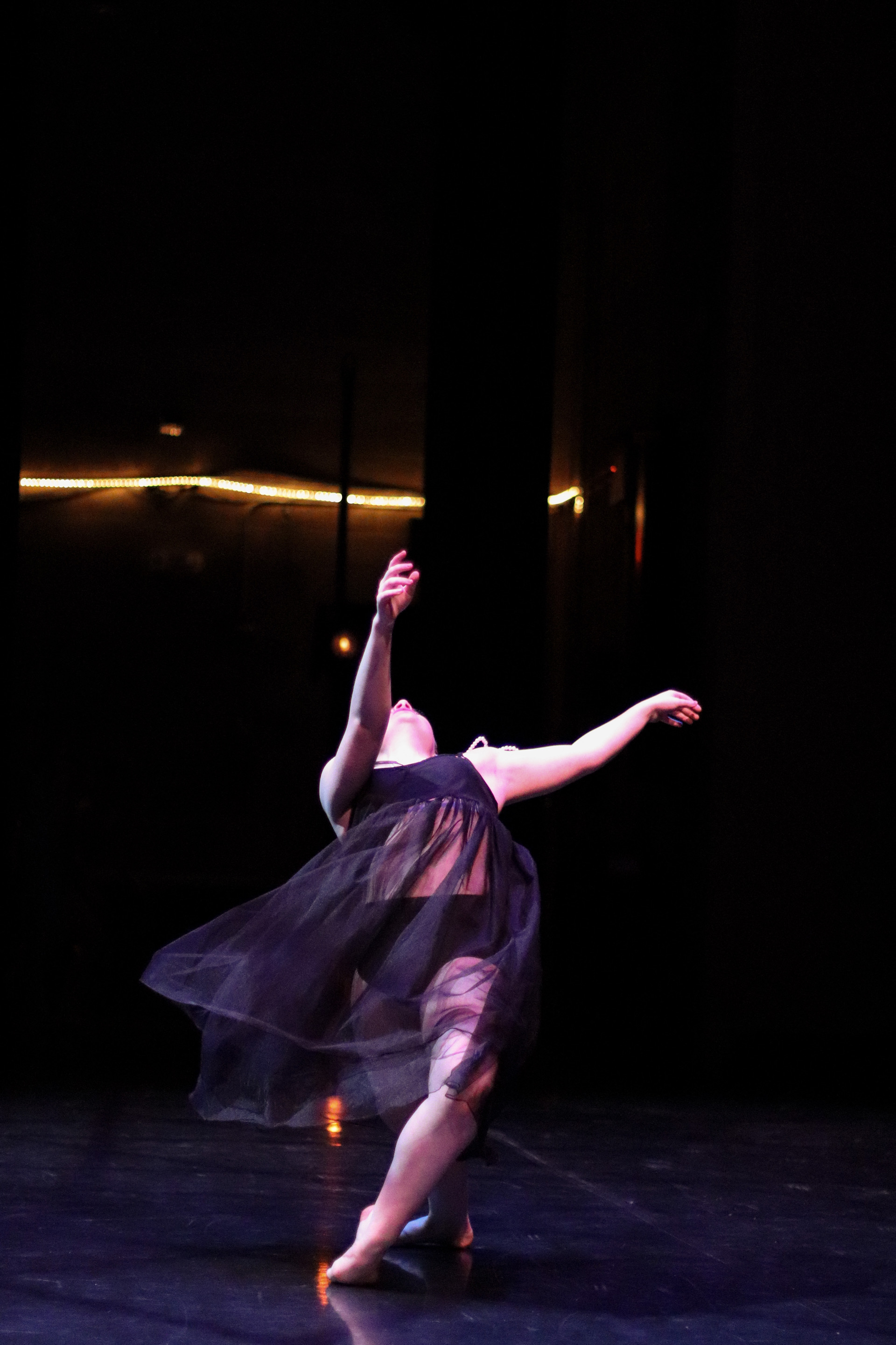 girl dancing on stage, rolling down to the ground